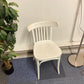 Left, tall green plant, White stick dining chair 