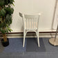 Left, tall green plant, centre, Back of Waiting area chair in white