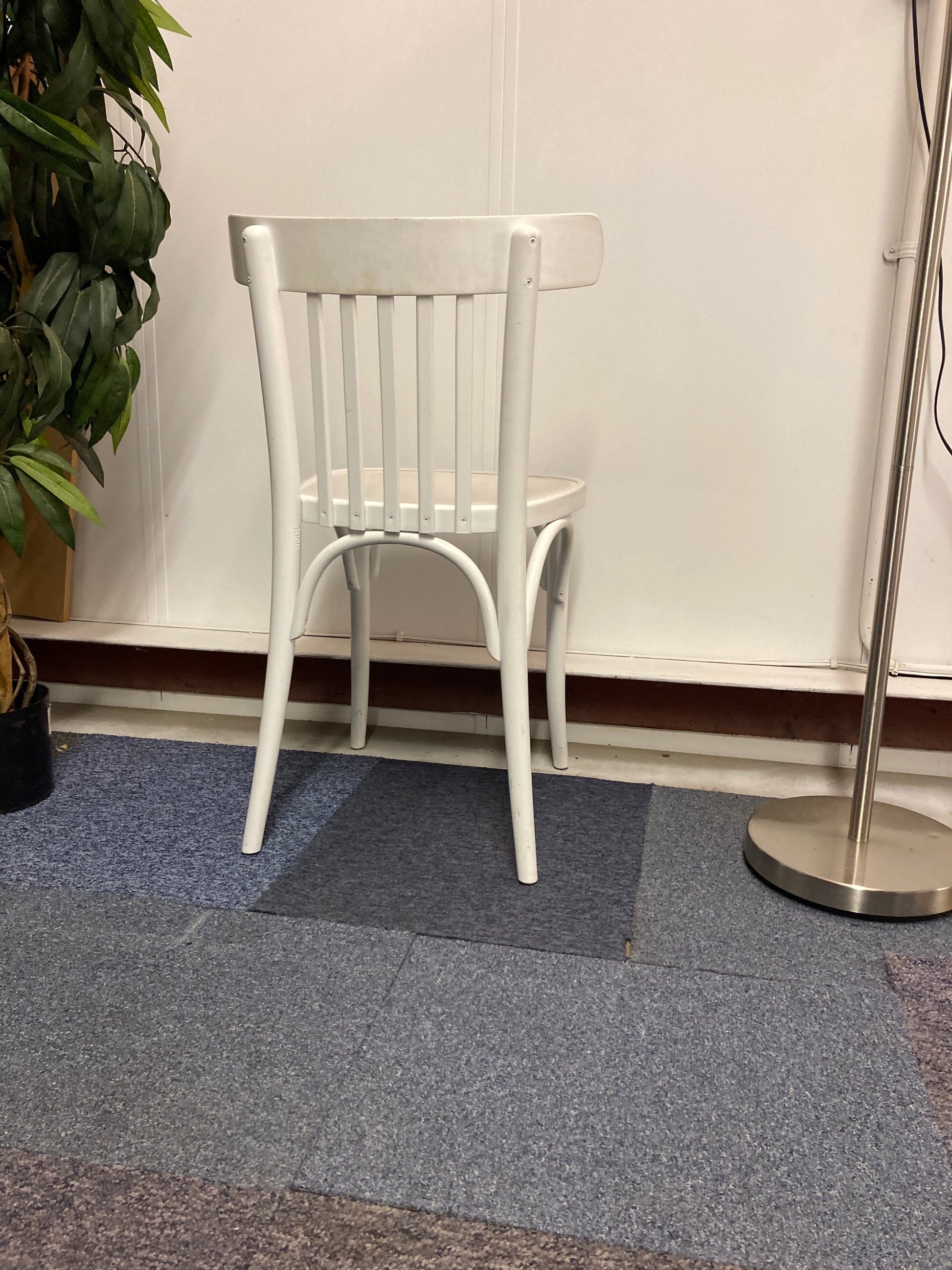 Left, green plant, centre, Back of Waiting area chair in white