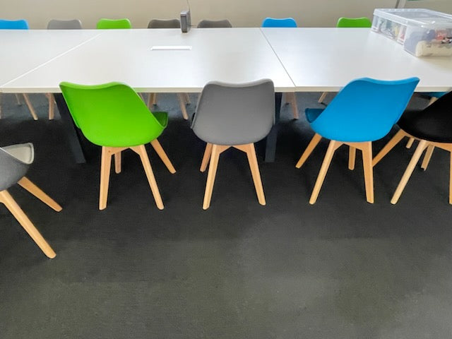 12 person conference table in white with multi colour chairs