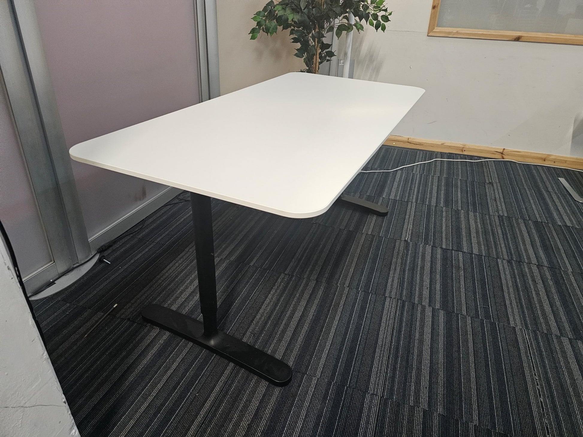 White office desk with black legs