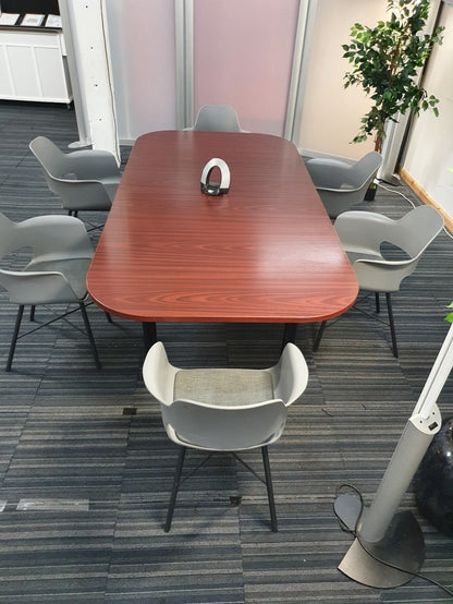 Conference Table with six chairs around in front of dividers