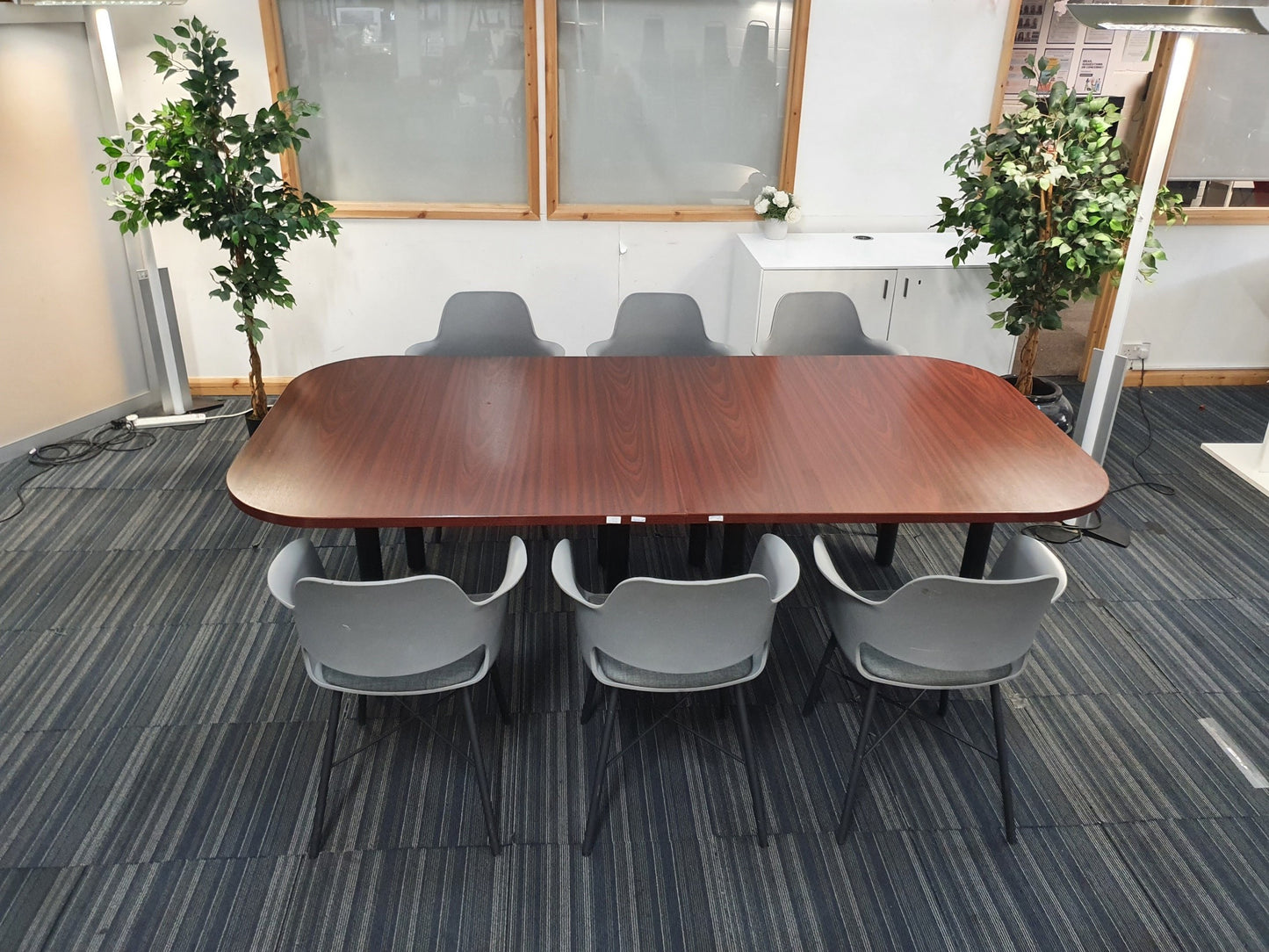 Large 10 seater boardroom table with grey chairs