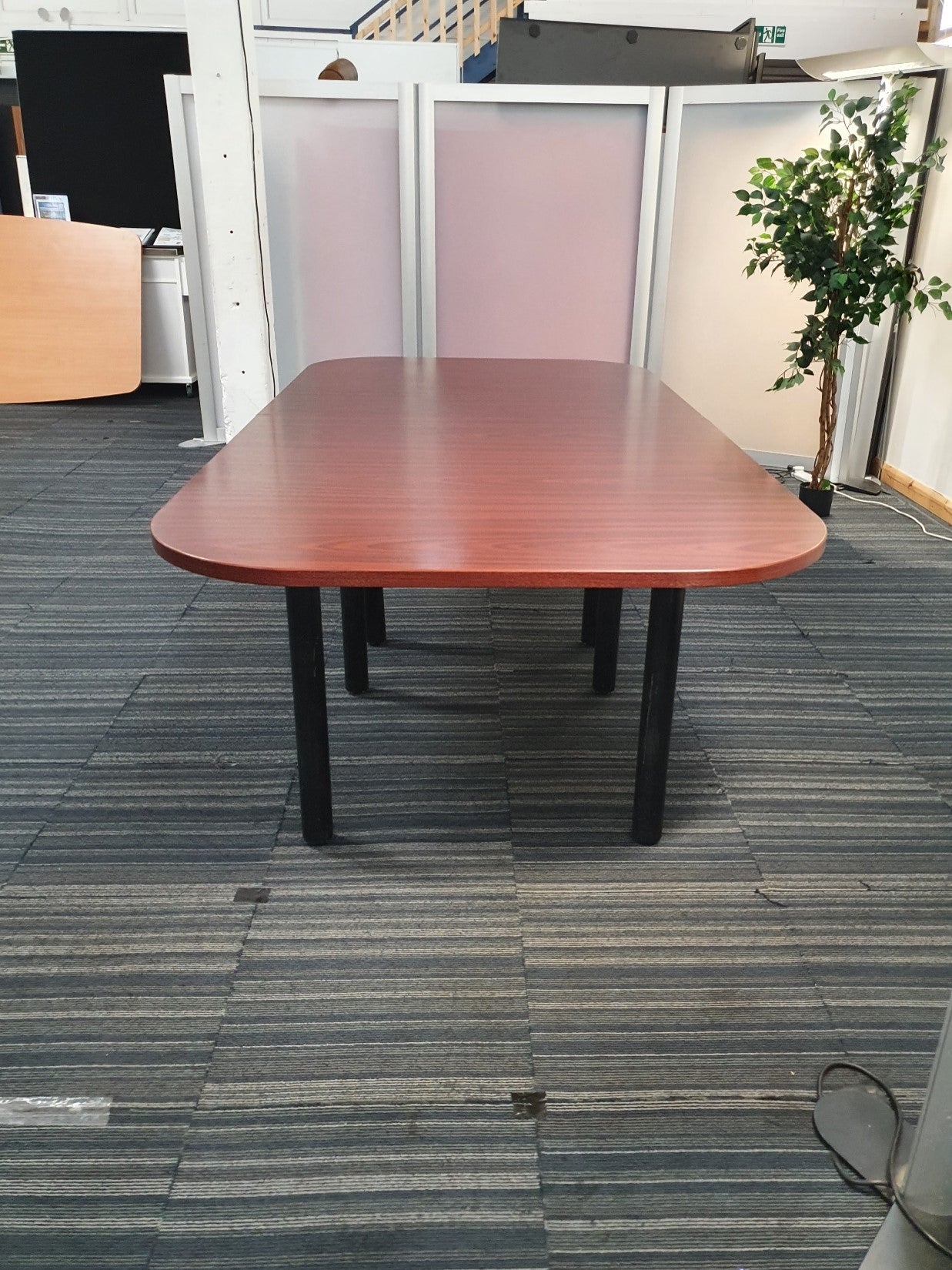 Clear meeting table in front of a divider