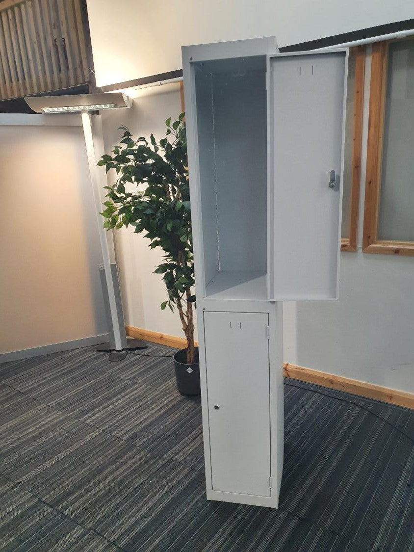 Standing lamp, green plant, 2 door grey locker, top door open