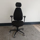 Black swivel desk chair with headrest