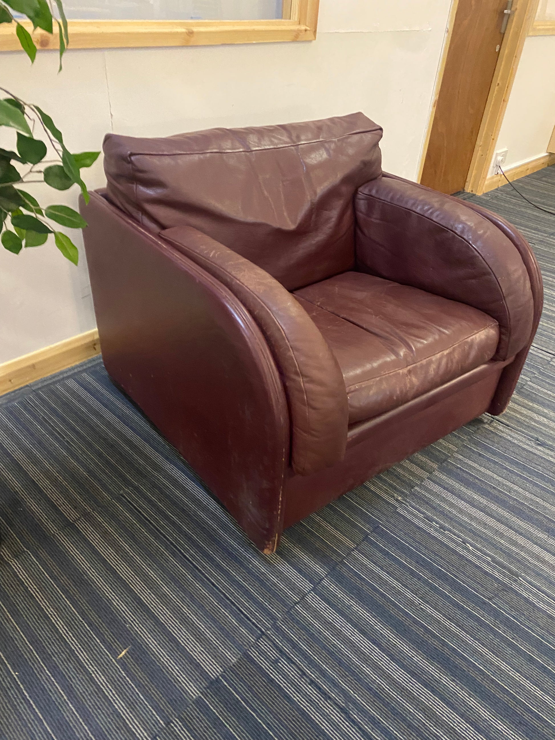 leather single armchair sofa on carpet side profile