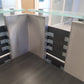 Corner of black and grey hair salon reception desk