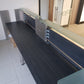 Black and silver glass front reception desk