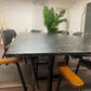 Black marble look tabletop of office meeting table and chairs