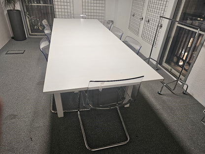 White IKEA Bjursta Dining table and TOBIAS PERSPEX chairs