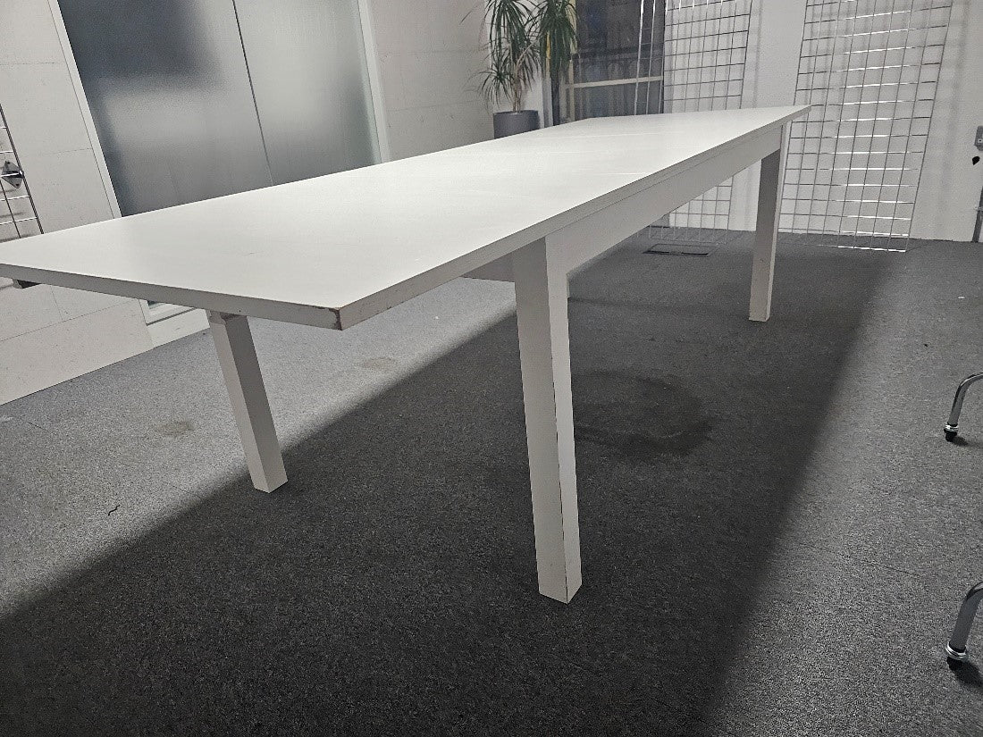 White extendable IKEA Bjursta Dining table