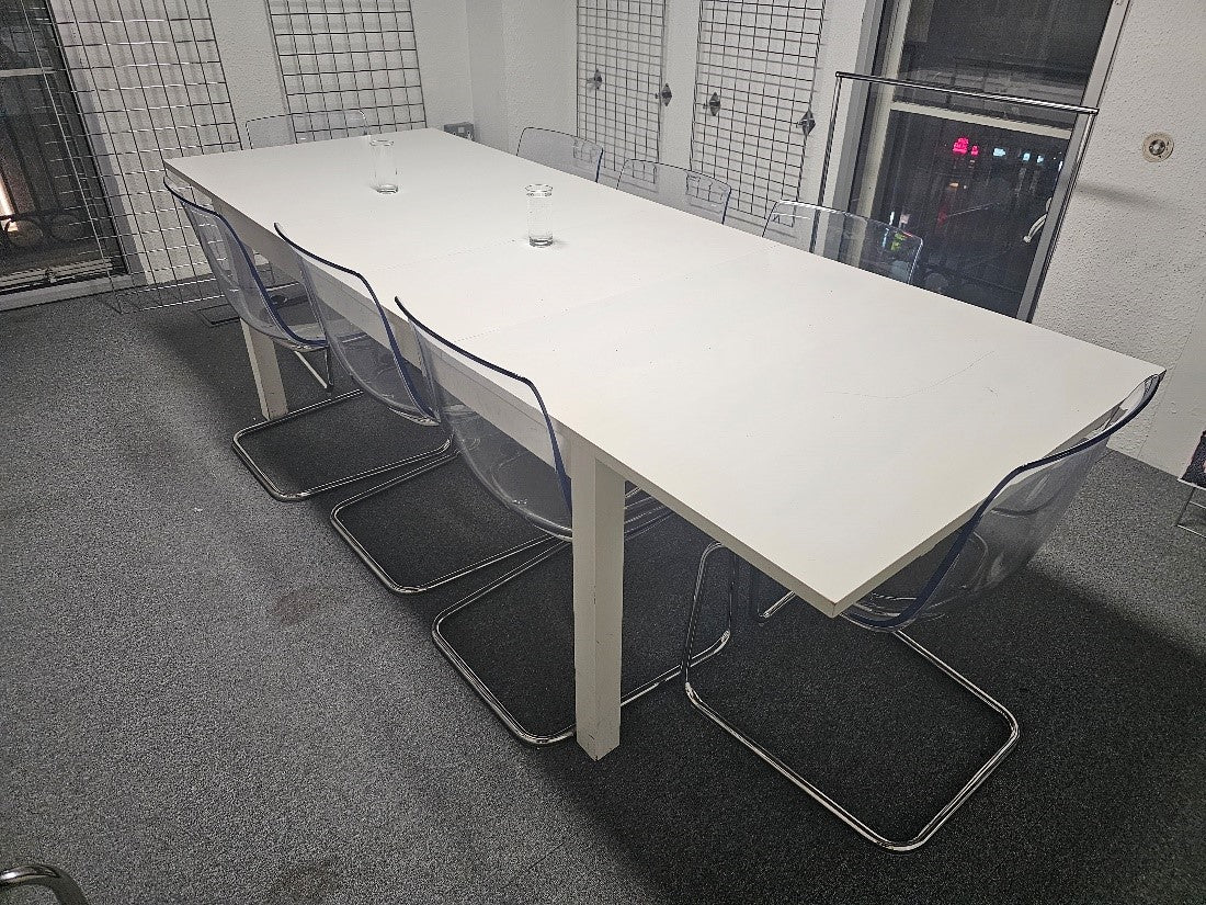 White IKEA Bjursta Dining table and eight IKEA TOBIAS chairs