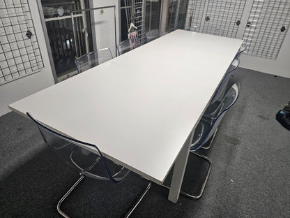 White IKEA Bjursta Dining table and eight chairs