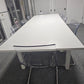 White IKEA Bjursta Dining table and eight transparent chairs