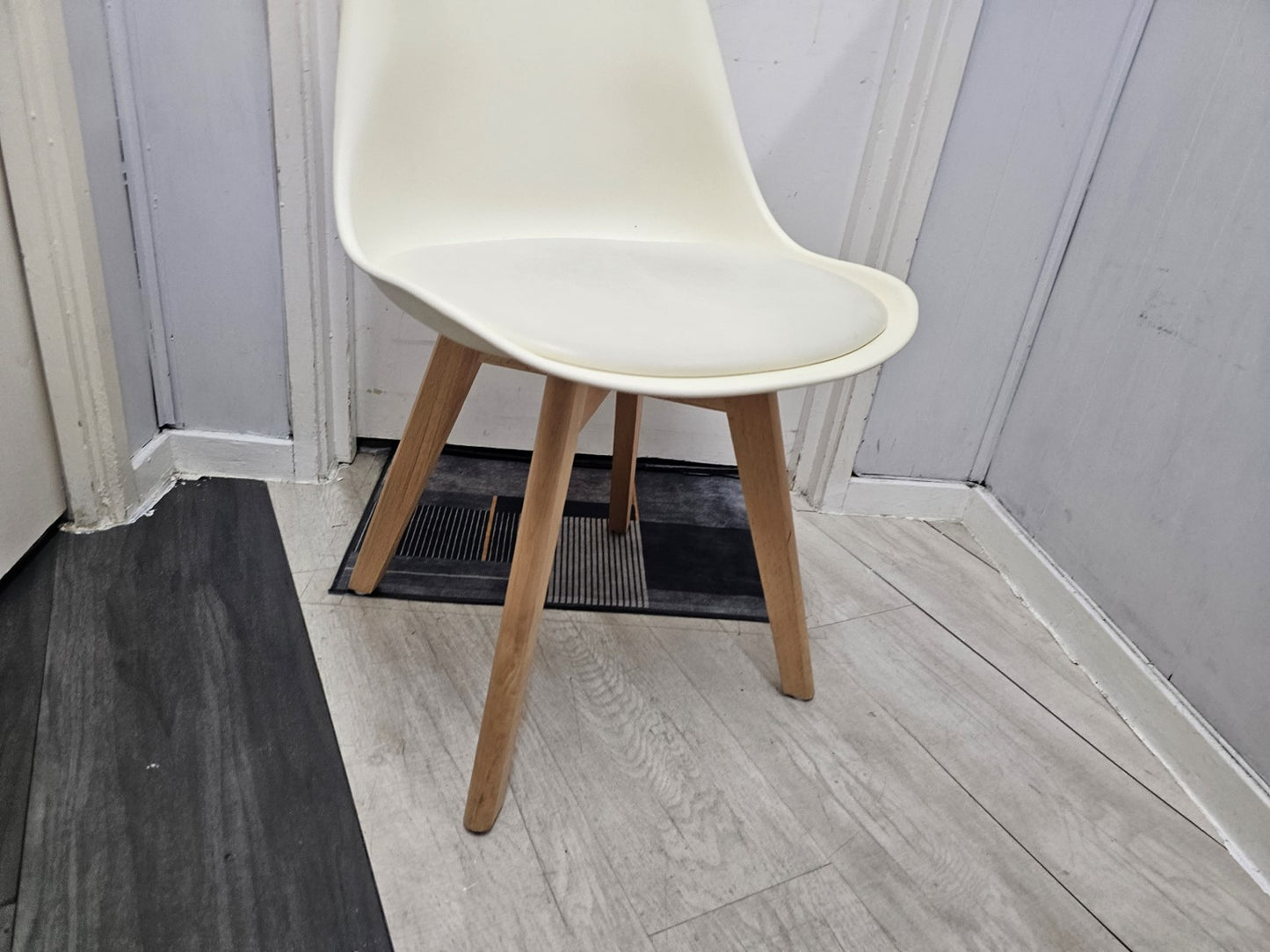 Wooden legs of white palstic canteen chair