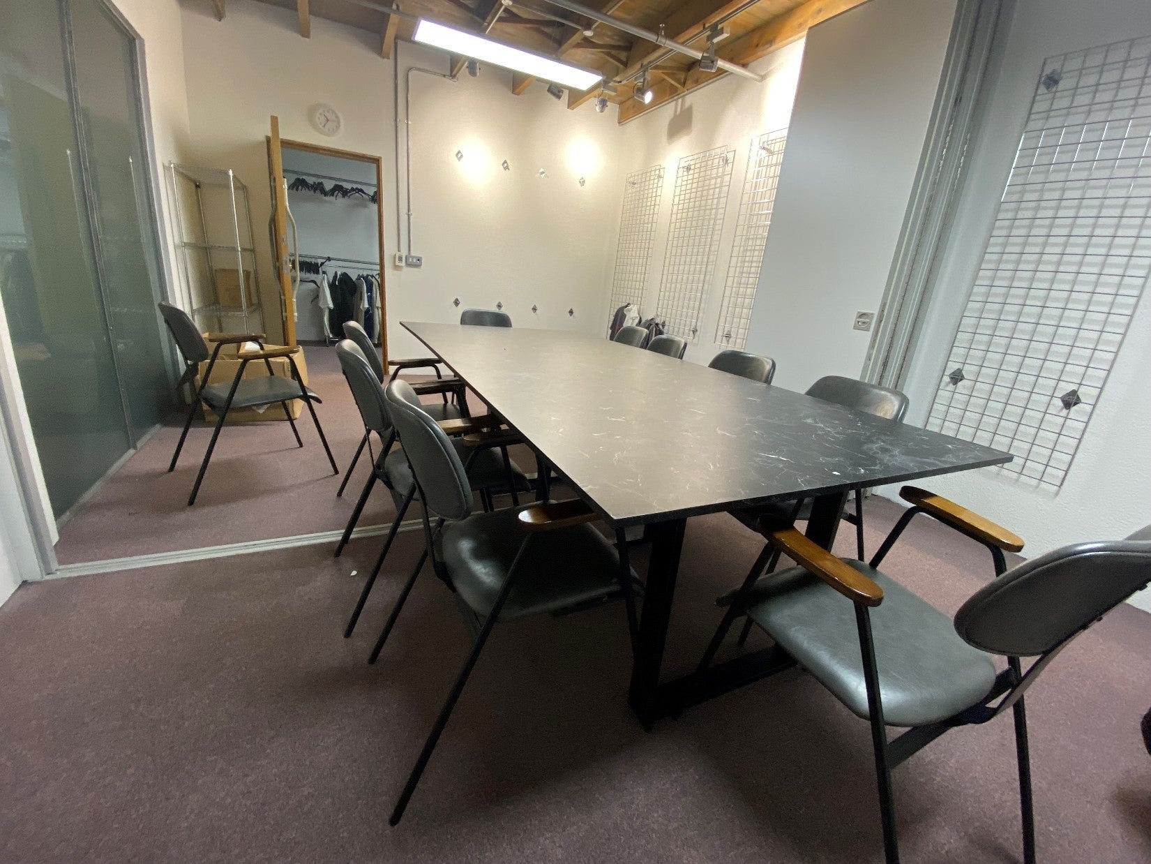 black marble look Large meeting room table, 10 grey chairs