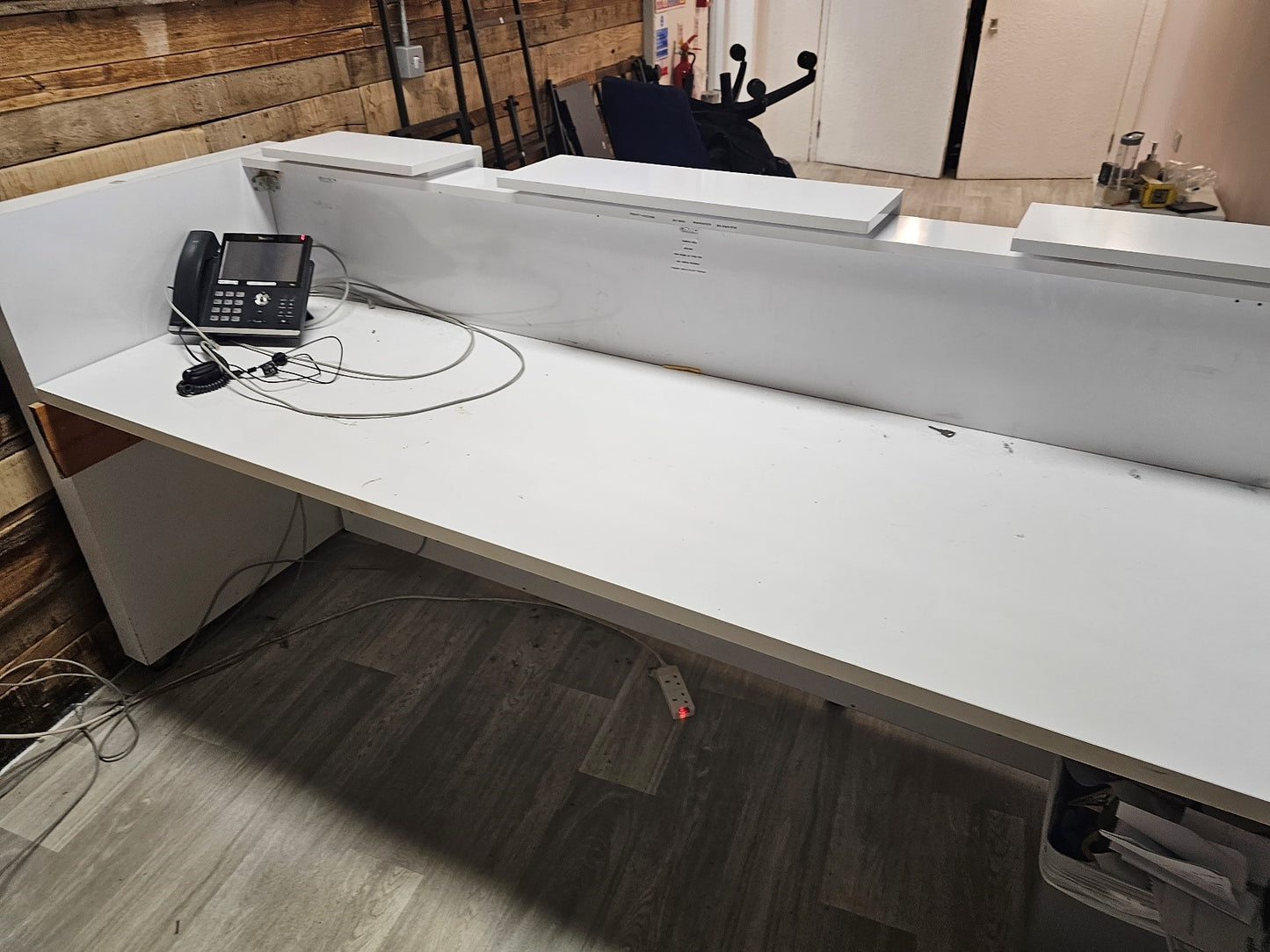 white reception desk with counter