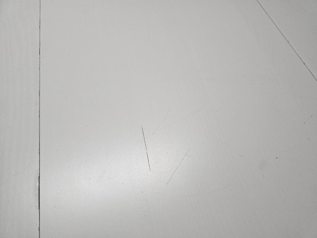 damage to tabletop of white dining table