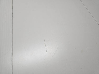 damage to tabletop of white dining table