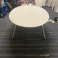 Oval white conference room table in large room