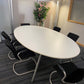 Oval white conference room table and 6 cantilever chairs