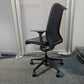 Back of black swivel leather chair