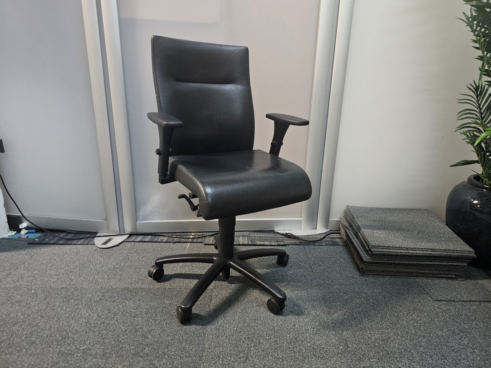 Leather office chair on wheels