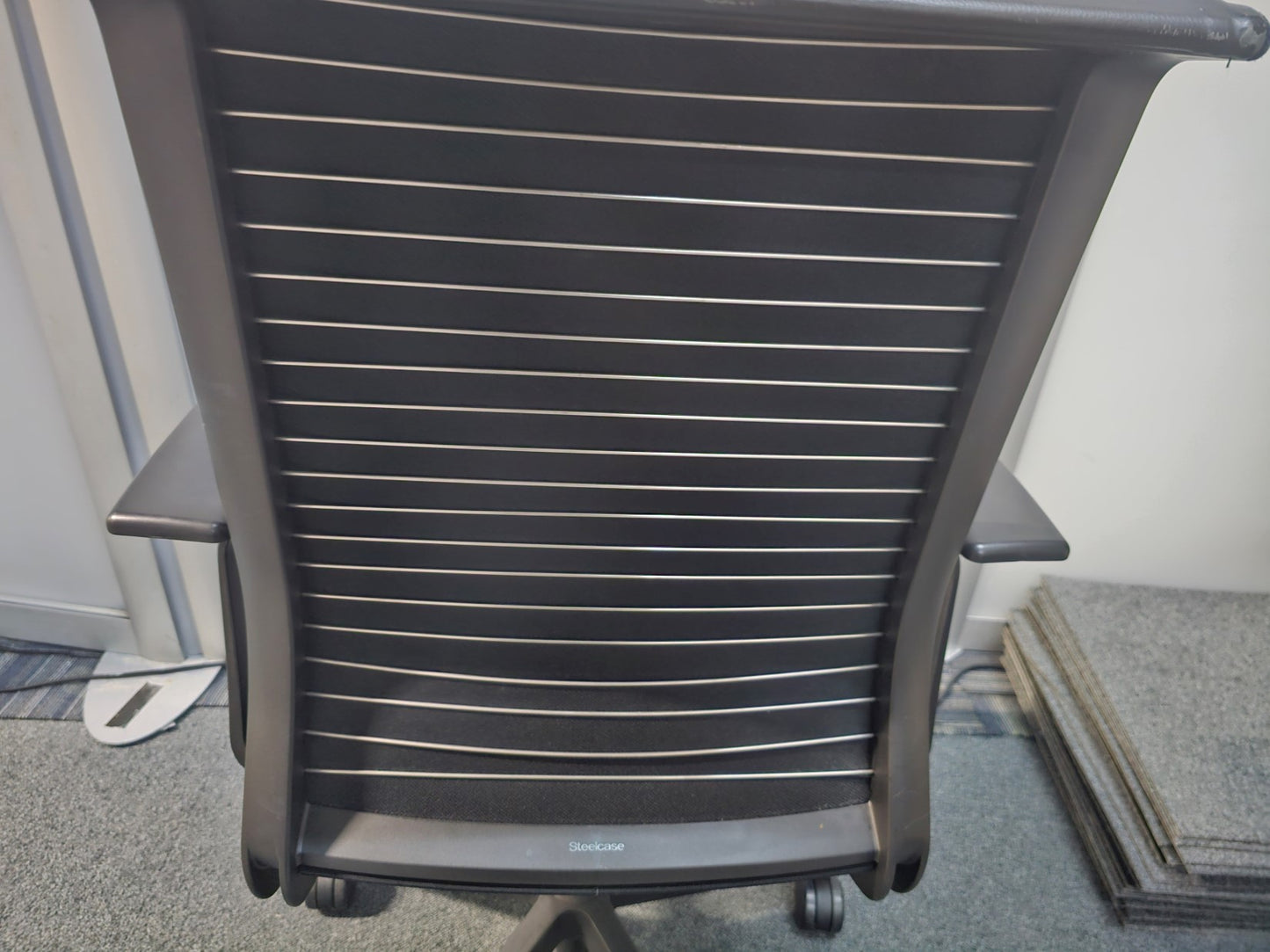 Back of black comfortable office desk chair