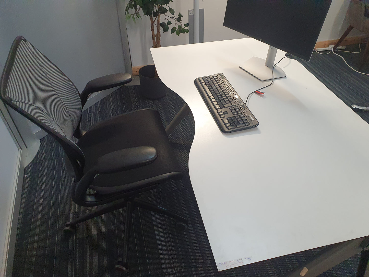 Computer set up workstation and dark grey chair