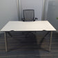 White office desk and dark grey swivel chair