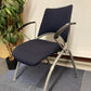 Verco blue office waiting area chair and tall green plant