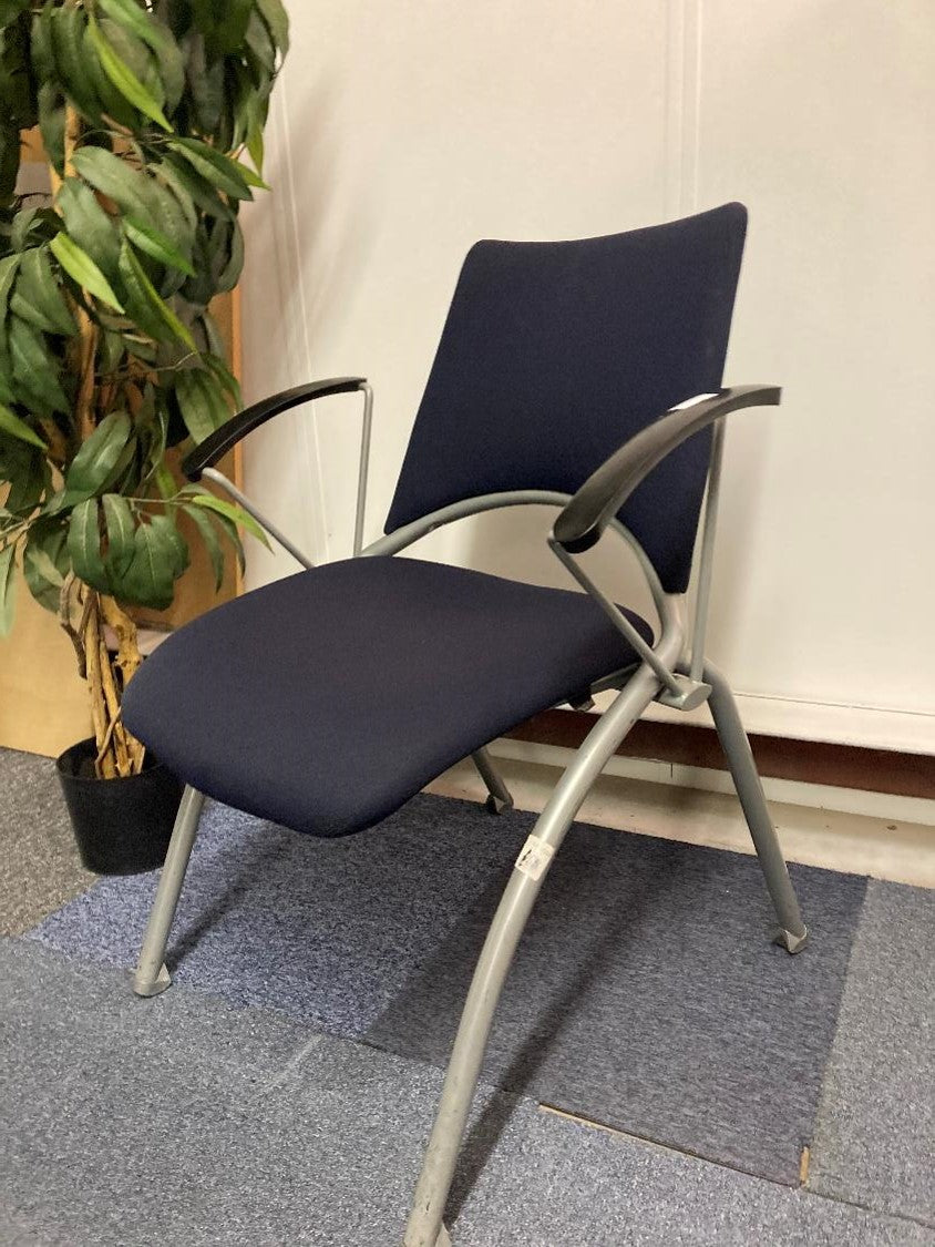 Verco blue office waiting area chair and tall green plant