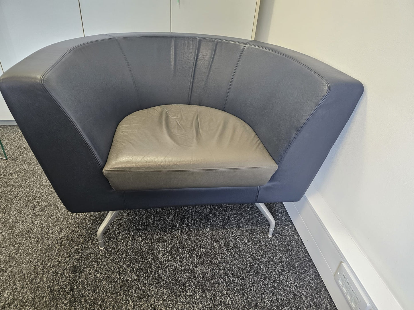 Reception area sofa in blue and black by Orangebox Cwtch