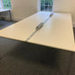 White four seater desk by window