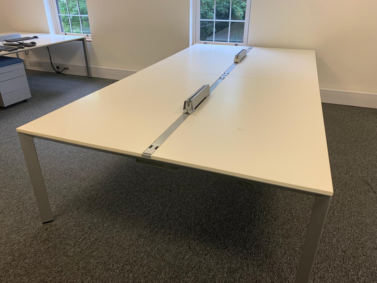 White four seater desk by window