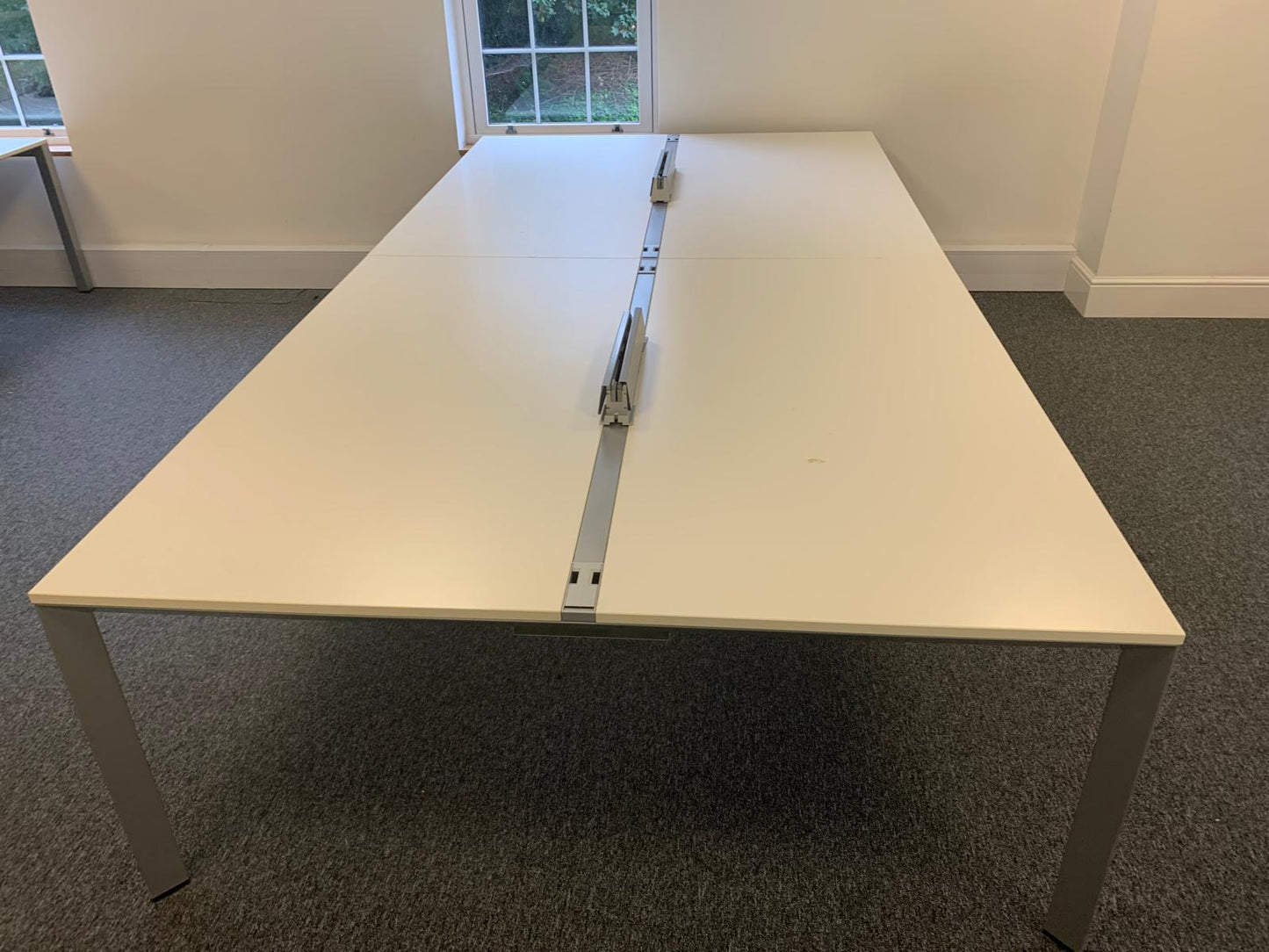 Tabletop of bank of 4 office desks