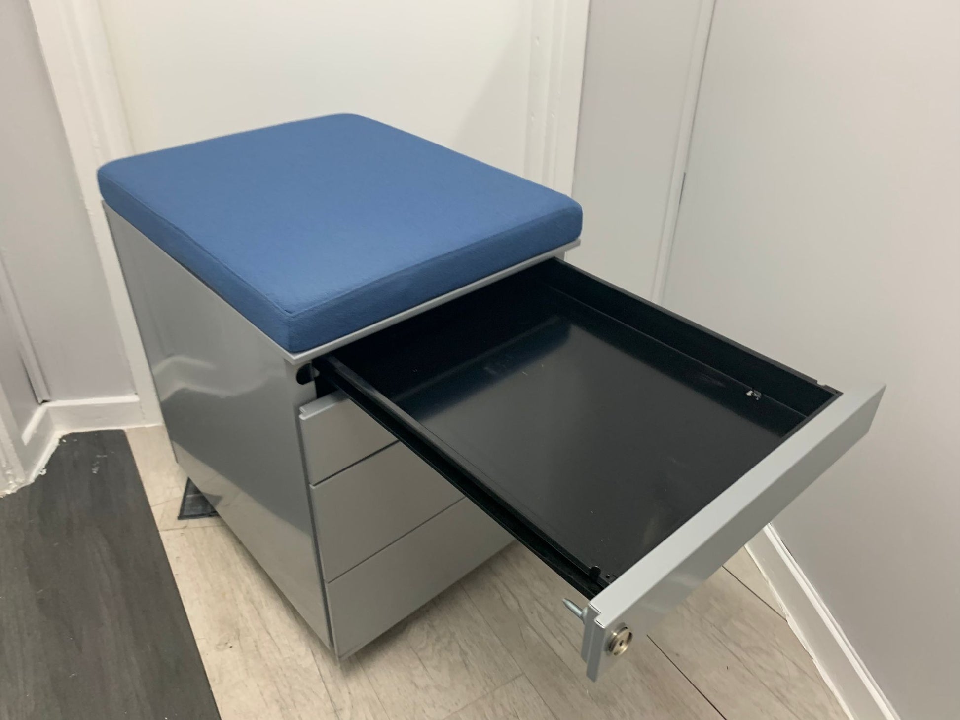 Open top drawer of four drawer mobile small cabinet