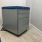 Grey and blue office filing cabinet on tiling