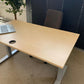 Light brown electric stand up office desk, sit stand height adjustable table in maple finish
