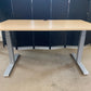 Light brown electric stand up office desk, sit stand height adjustable table in maple finish