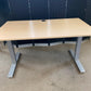 Light brown electric stand up office desk, sit stand height adjustable table in maple finish