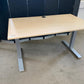 Light brown electric stand up office desk, sit stand height adjustable table in maple finish