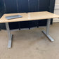 Light brown electric stand up office desk, sit stand height adjustable table in maple finish
