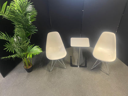 Used Eames Plastic Side Chair DSR by Vitra features a white polypropylene shell and a distinctive chrome "Eiffel" wire base