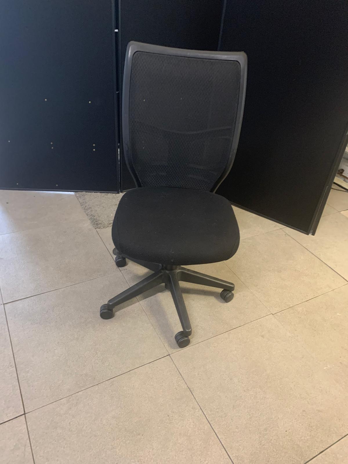 Secondhand armless ergonomic swivel office desk chair on castors