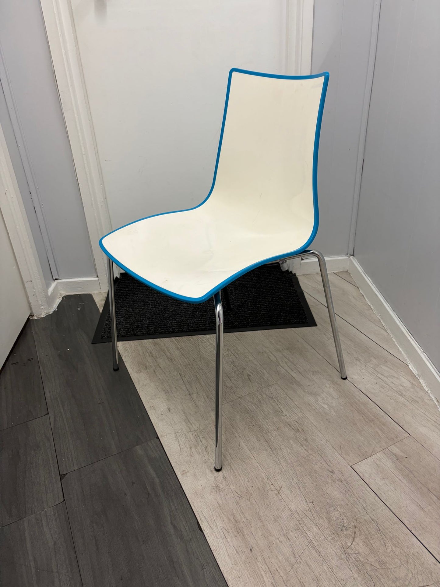 Secondhand dining chair with chrome legs - stackable turtle shell design