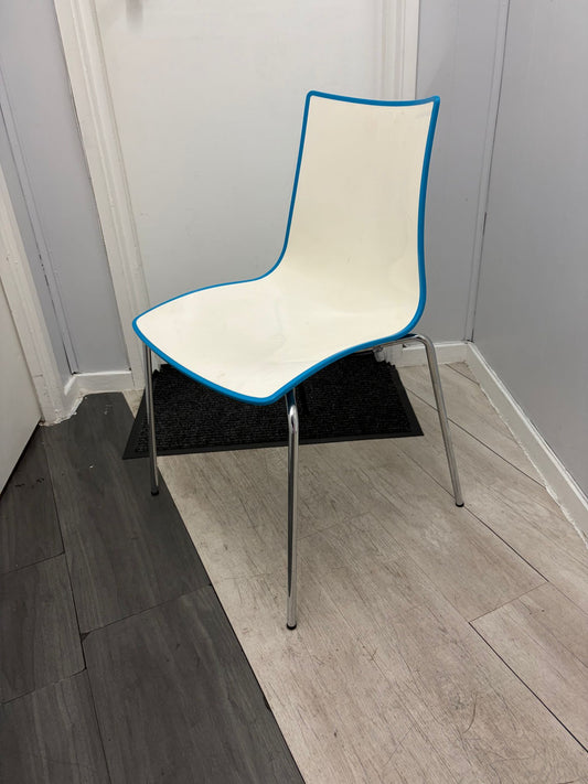 Secondhand dining chair with chrome legs - stackable turtle shell design