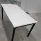 side of  white folding office table with black legs
