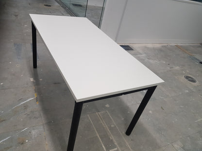 side of  white folding office table with black legs